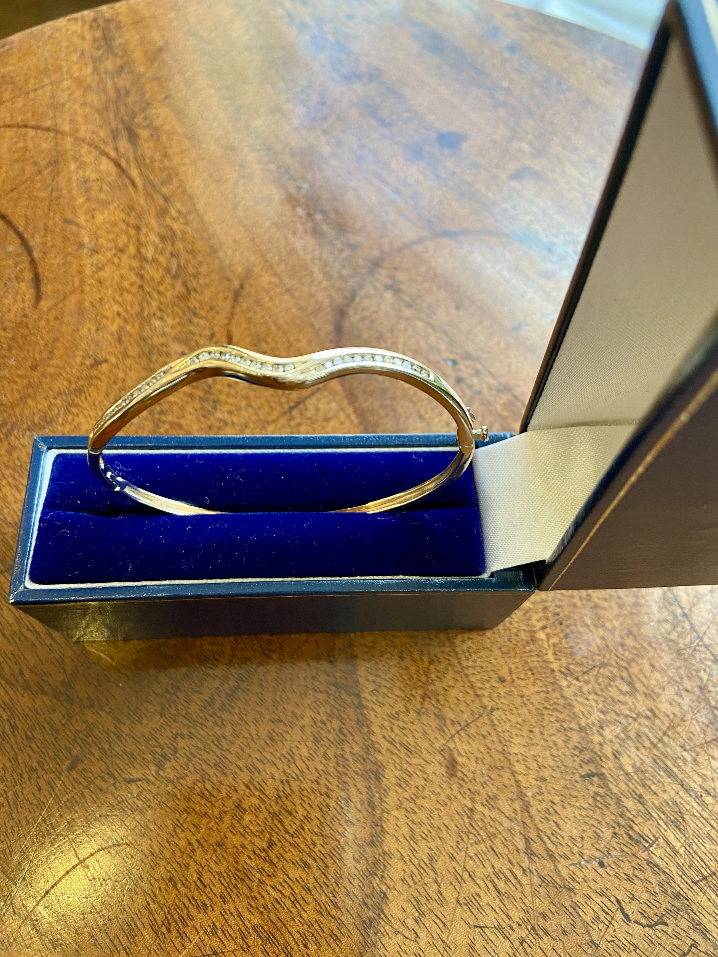 9ct gold and diamond hinged bracelet.