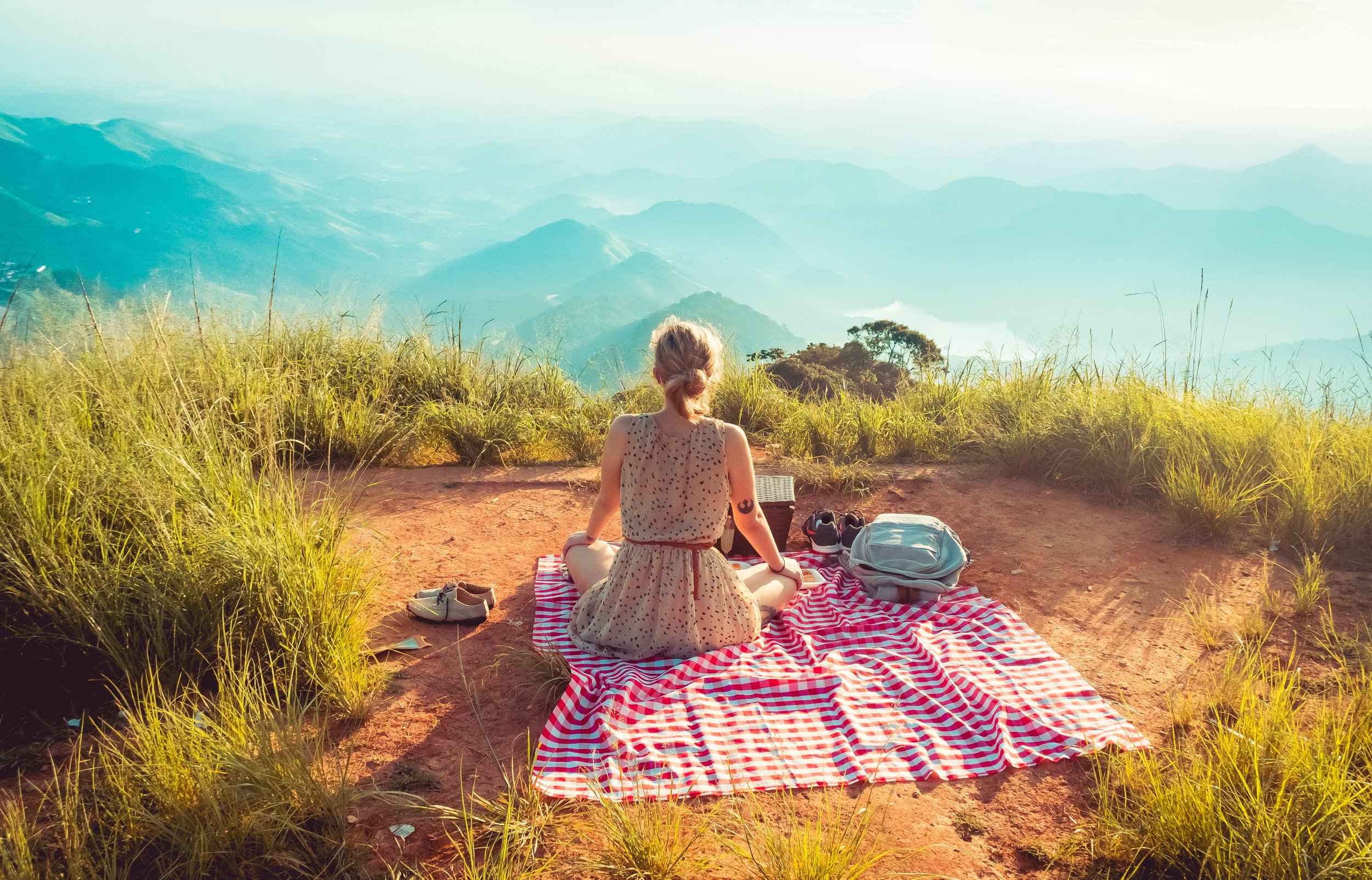 Woman on Blanket overlooking Mountains.jpg