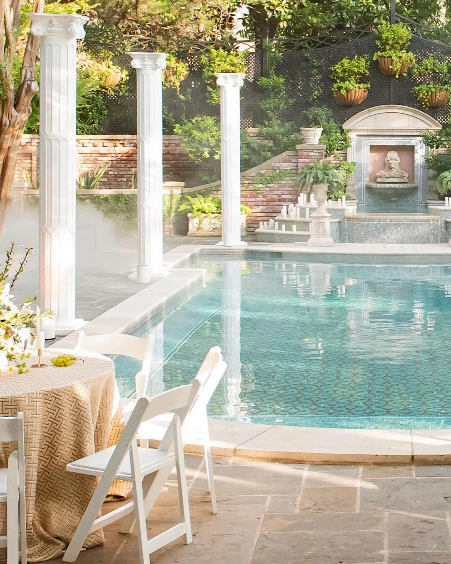 a 40th birthday celebration turned grecian feast for all the senses. guests enjoyed: a full backyard transformation featuring 10 foot columns, sculptural forms paired with lush florals, an abundant spread of bites, harp melodies to set the tone and s