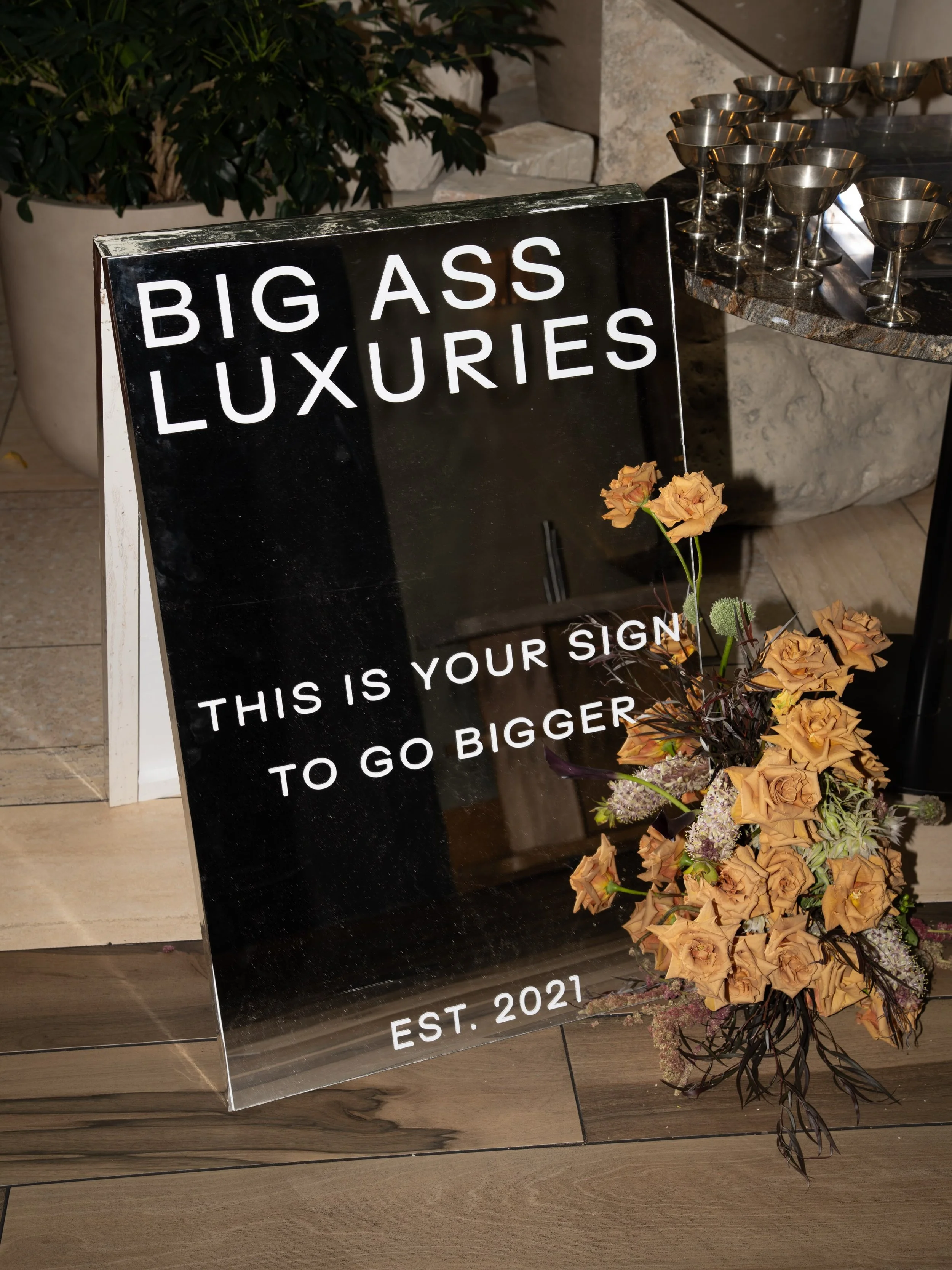 A reflective evening celebrating five years of @bigassluxuries and the debut of Santal N&deg;V, a limited-edition candle created to mark the milestone. Mirrored details, glowing candlelight, and layers of texture came together to create moments that 