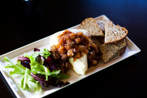 Warm Brie w:golden raisin-apple compote, whole grain crostini and tossed greens.jpg