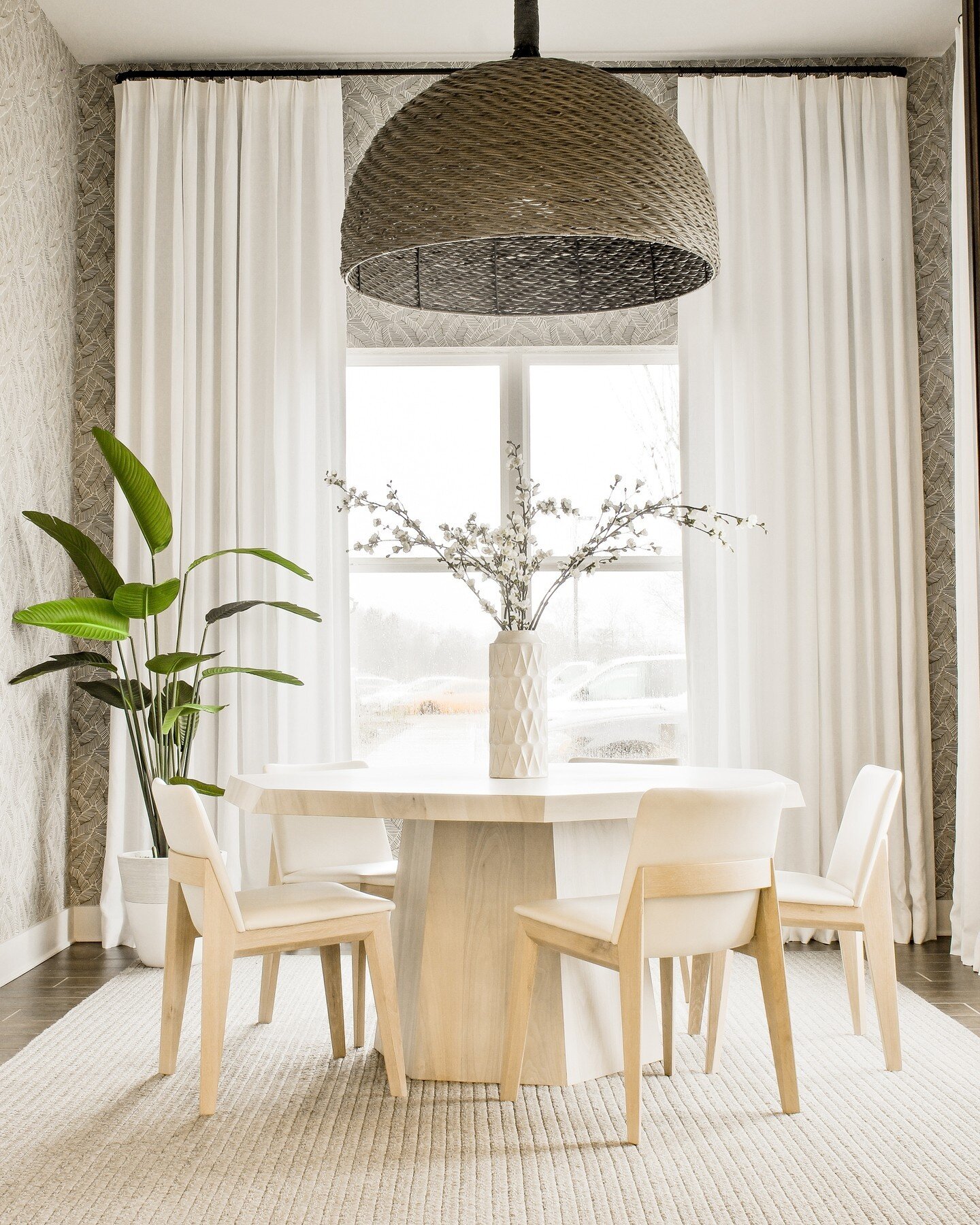 Take a peek inside this nature-inspired conference room! With warm, palm-leaf wallpaper and organic touches, this space is the perfect spot for your next meeting.