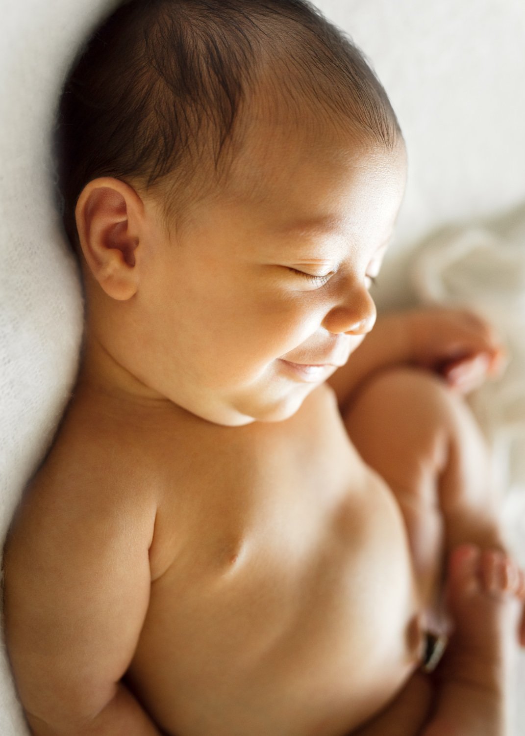 Newborn Baby Smiling In Sleep