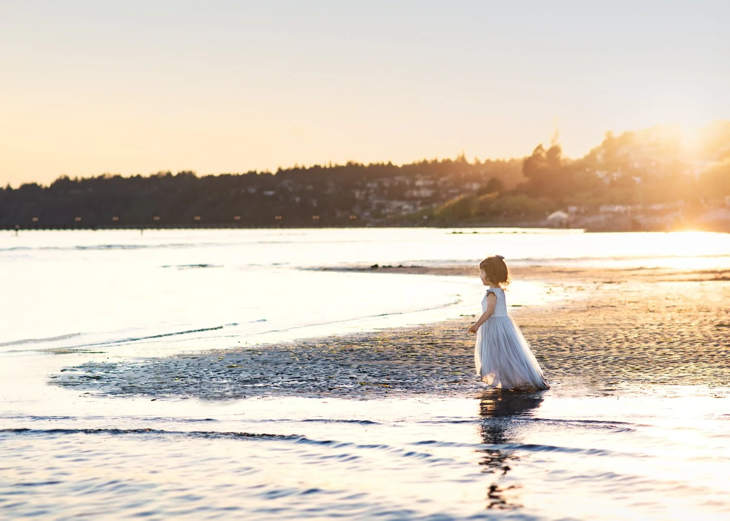White Rock Beach Family Session with little girl looking out towards the ocean at sunset