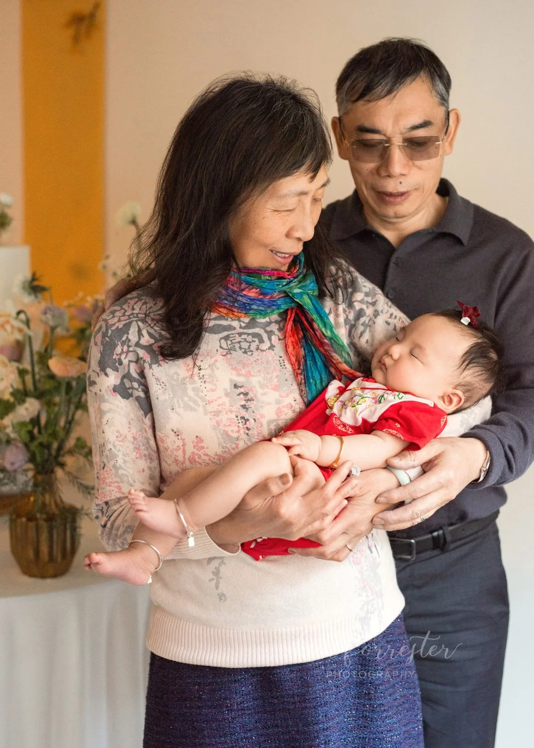 Grandparents celebrating 100-day-old baby
