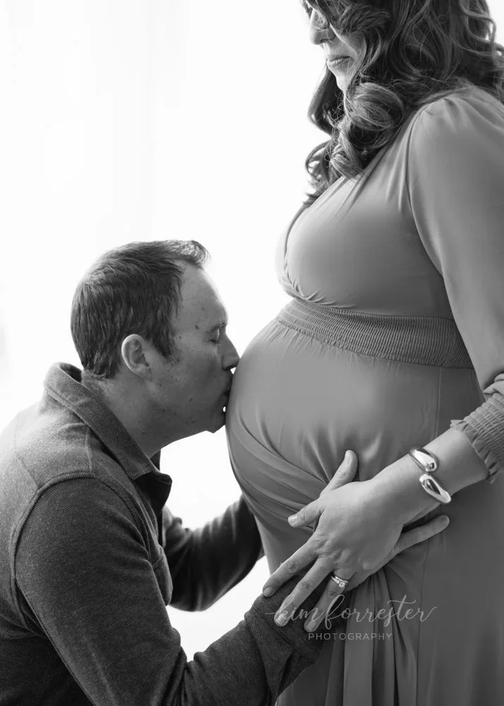 Dad Kissing Mom's Baby Bump