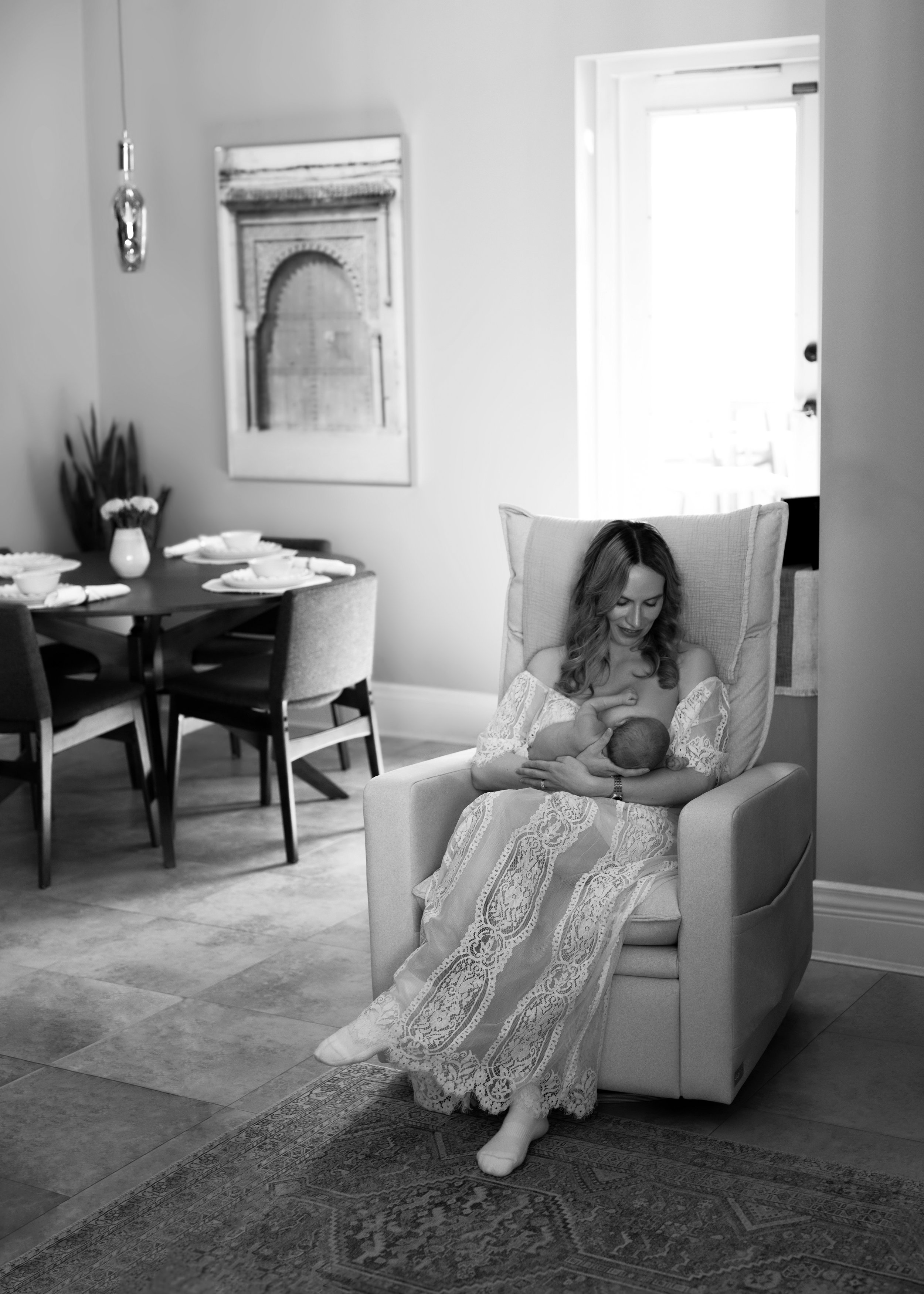 Mom in rocking chair with newborn