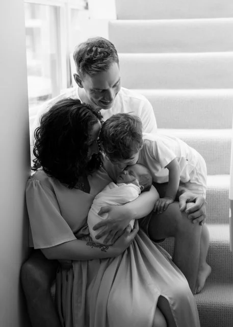 Older Brother Kissing Newborn