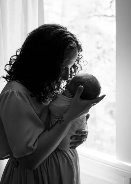 Mom and Newborn beside window