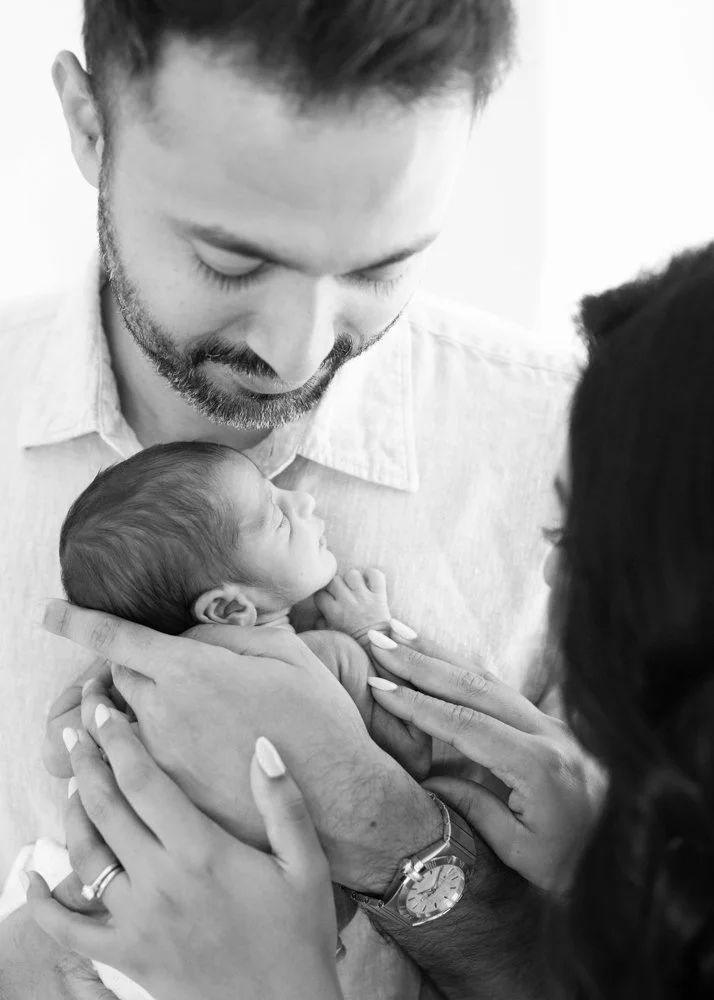 Held against dad&rsquo;s chest, safe and warm, this tiny newborn is already learning what it means to be loved unconditionally. There&rsquo;s a quiet joy in these early days - the soft snuggles, gentle breaths, and small details that pass so quickly.
