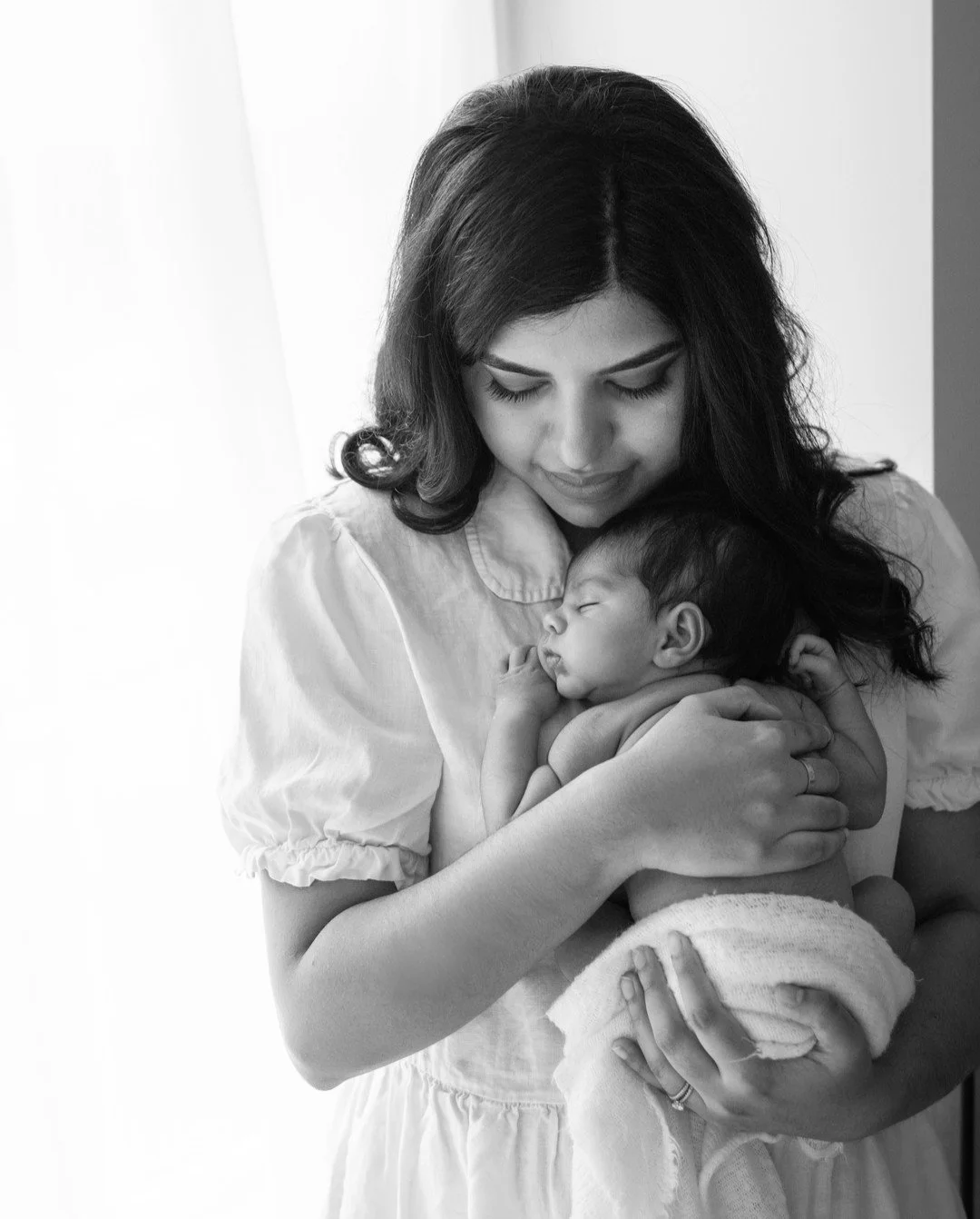 Quiet, calm, and exactly how it feels to be held close. A soft moment at home in the quiet of their nursery.

#KelownaNewbornPhotographer
#OkanaganNewborn
#VernonBC
#VancouverBC
#LifestyleNewborn
#InHomeNewborn
#BlackAndWhitePhotography
#NaturalLight