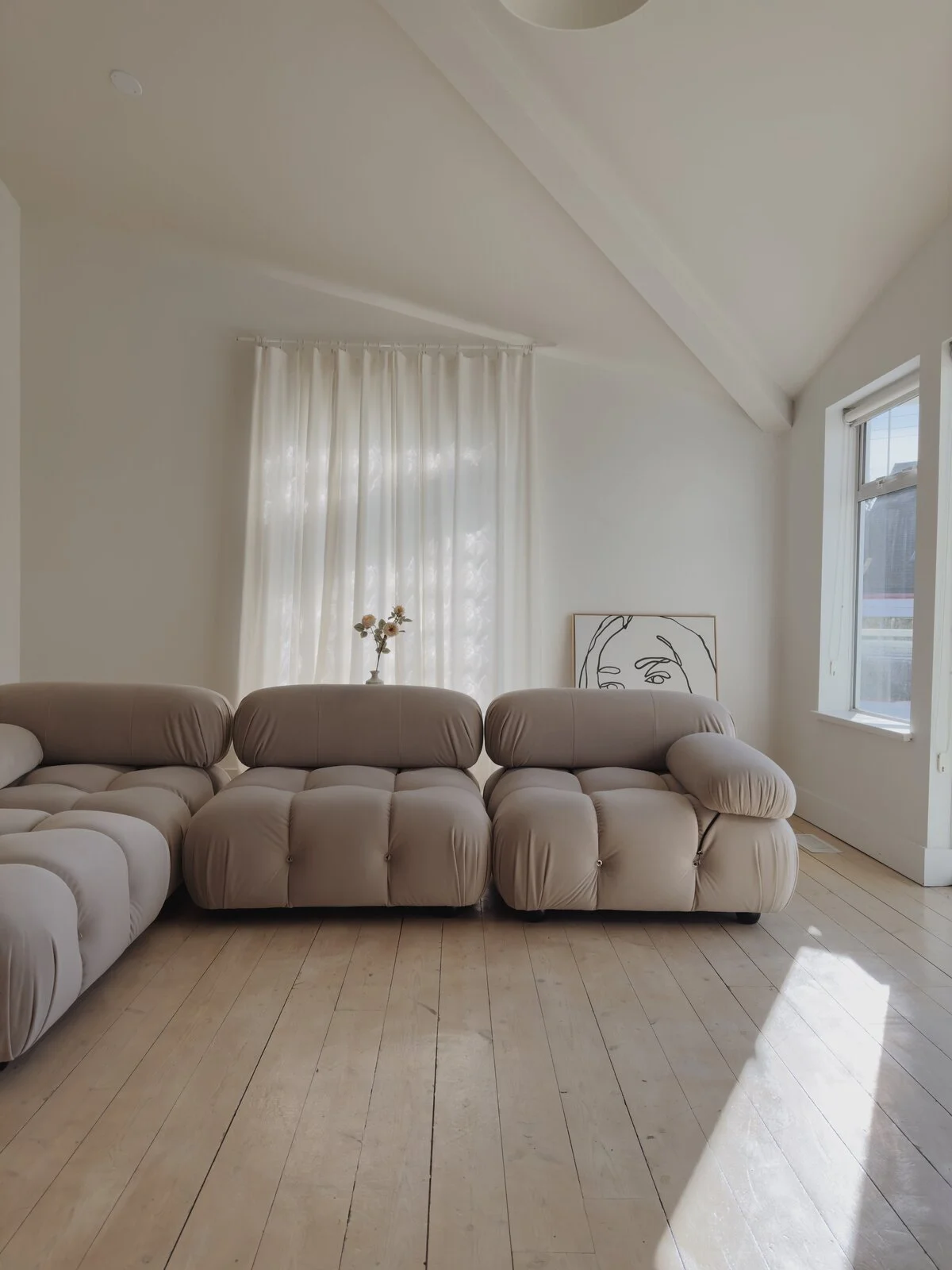 Studio with high ceilings and neutral aesthetic