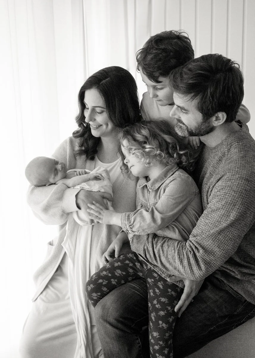 Newborn Photographer capturing family of 5 at home