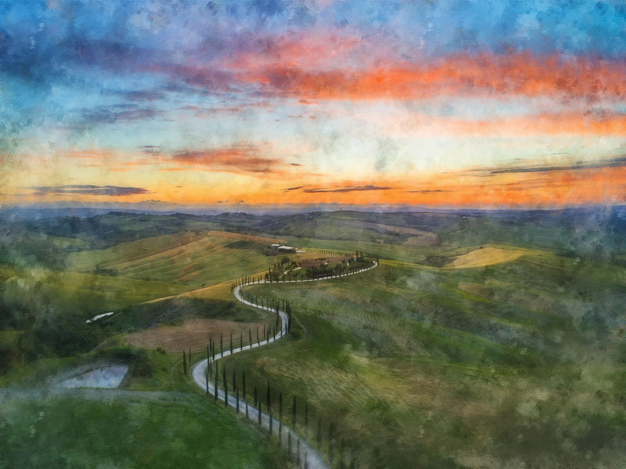 A winding road runs through rolling green hills under a colorful sky at sunset.