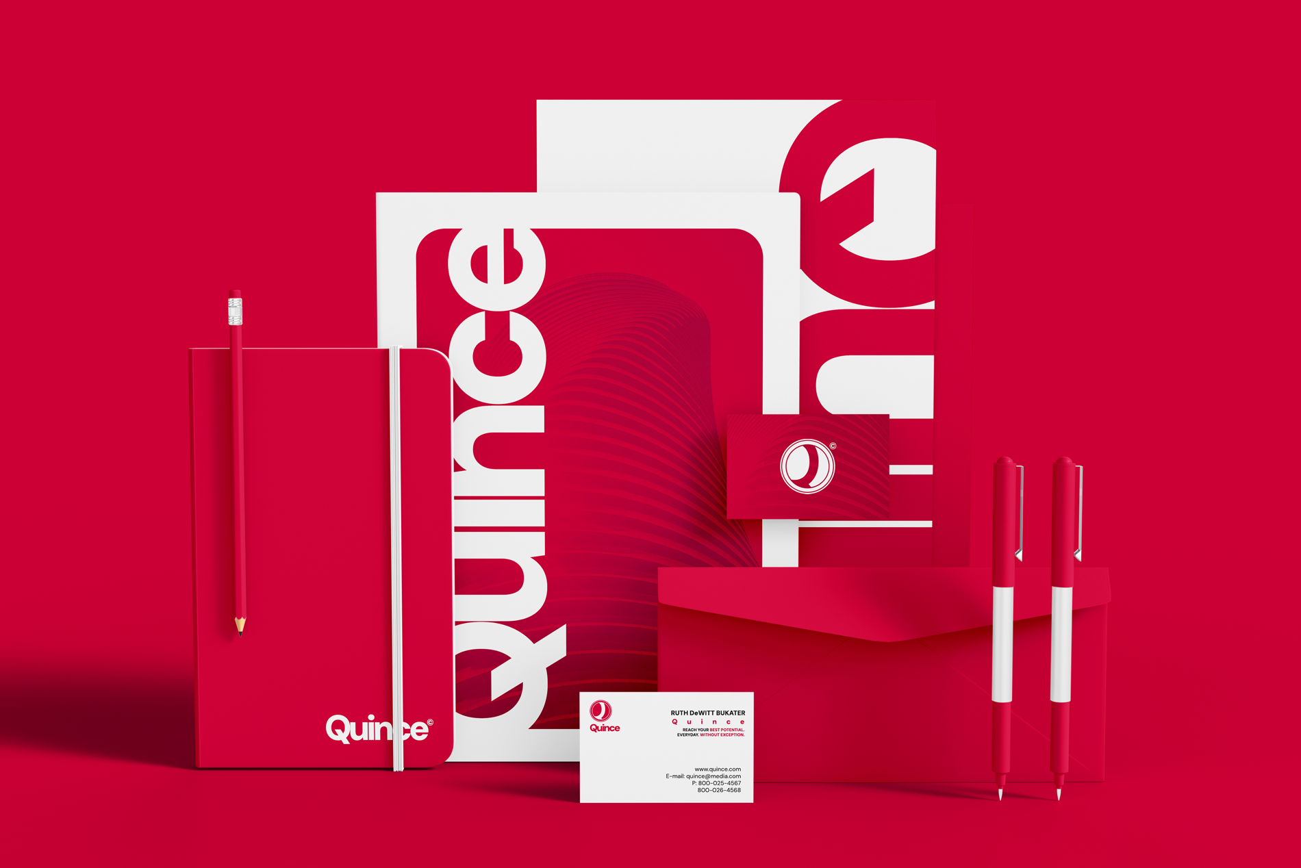 Multiple Quince office supplies on a red background, including a red notebook with a white elastic band and logo, a red pencil, two red and white pens, a white card with contact info, and various red and white posters and packaging featuring the Quin
