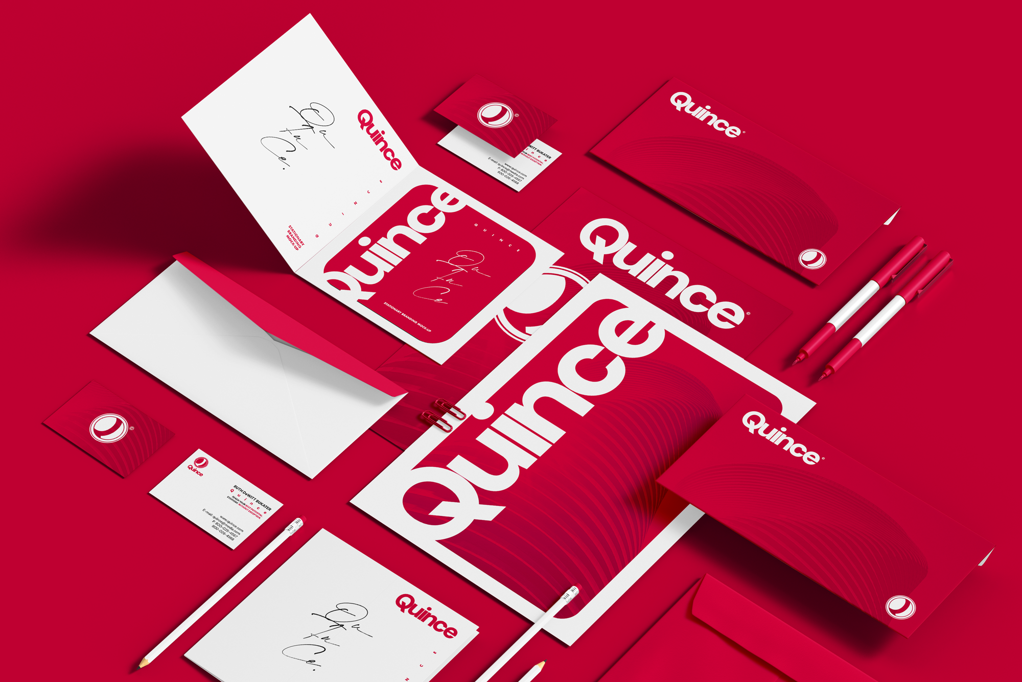 Red and white branded stationery and marketing materials for Quince, including posters, flyers, business cards, pens, and envelopes, arranged on a red surface.