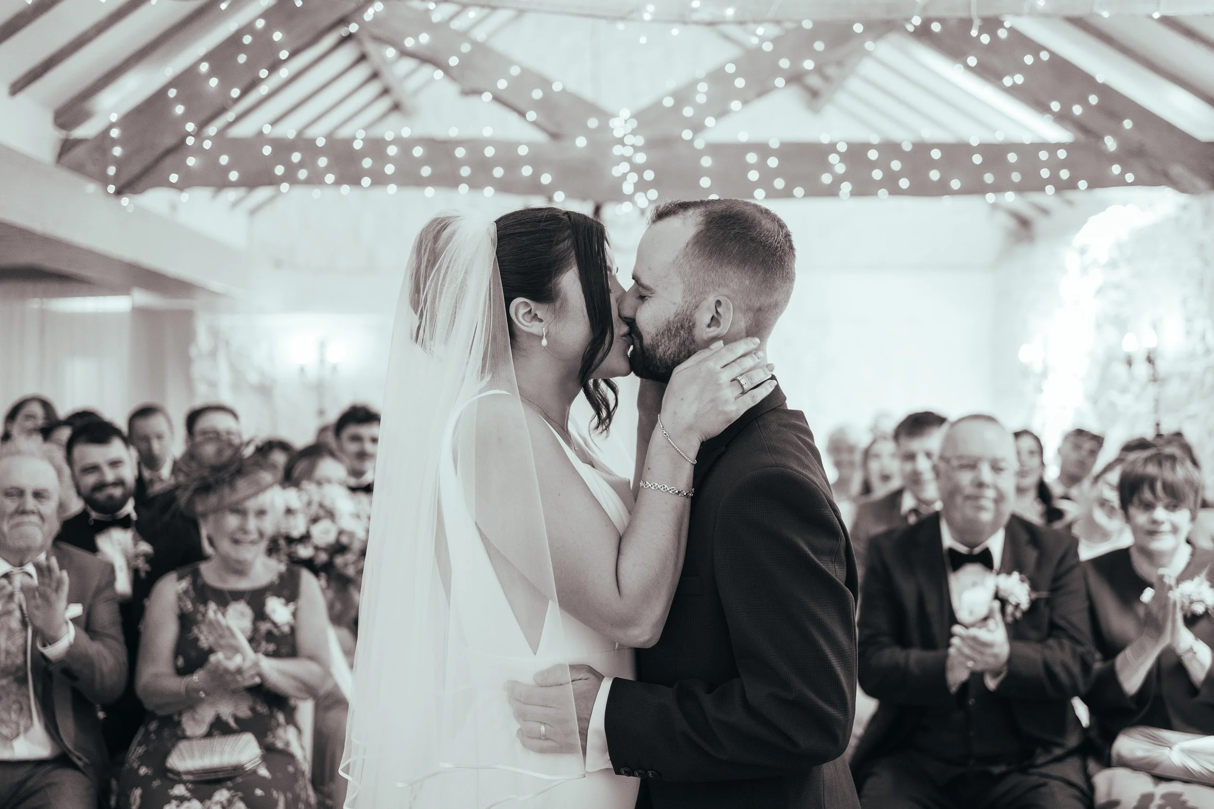 First Kiss at a Devon Wedding - Bride and Groom kissing