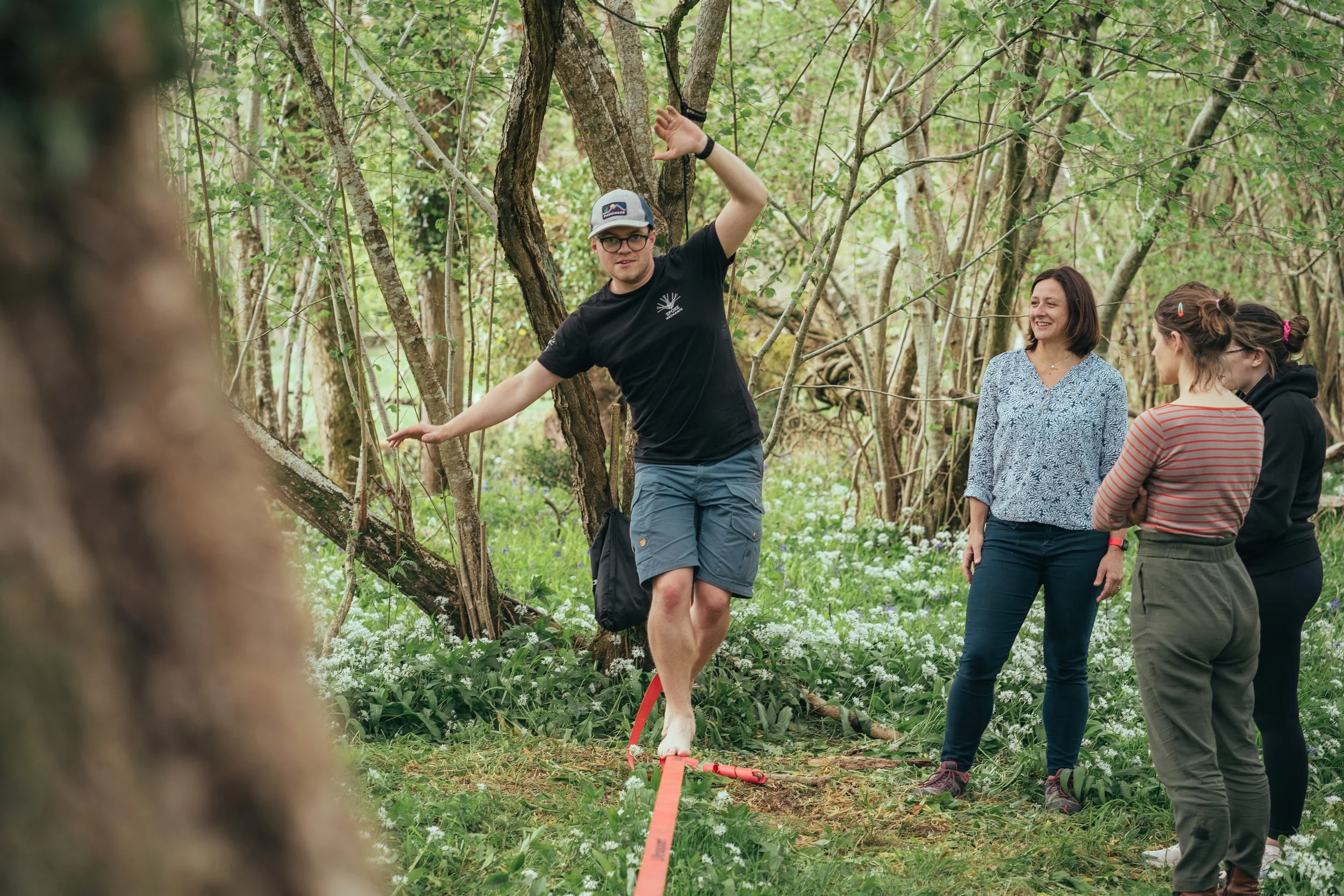 Photographer, Dave Zaple - barefoot on a slackline in the woods