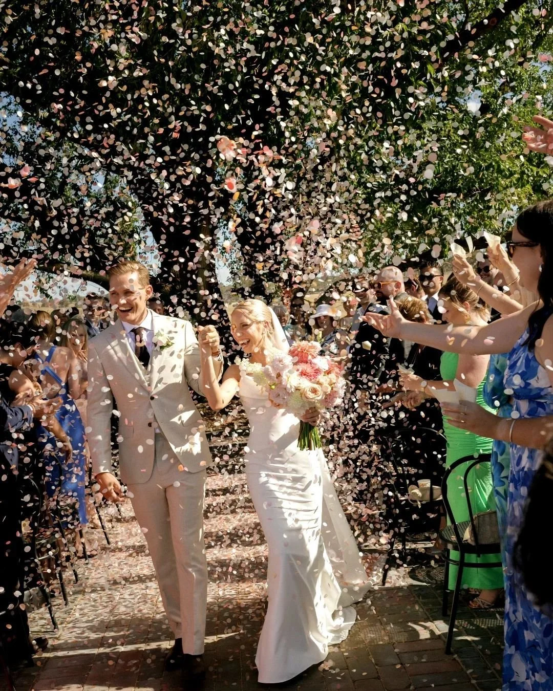 There's something about that moment when you walk back down the aisle as newlyweds, and suddenly the air is filled with a thousand tiny celebrations.
It's joyful. It's cinematic. It's the kind of moment that makes you feel like the main character in 
