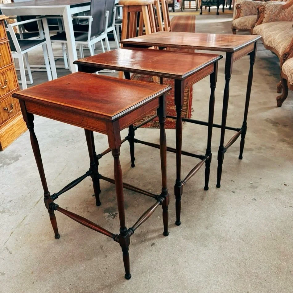 We have this beautiful Edwardian style, nest of tables available in store. They slide perfectly into one another. 

Set - R1950

Biggest table dimensions:
L-560mm
D-365mm
H-650mm