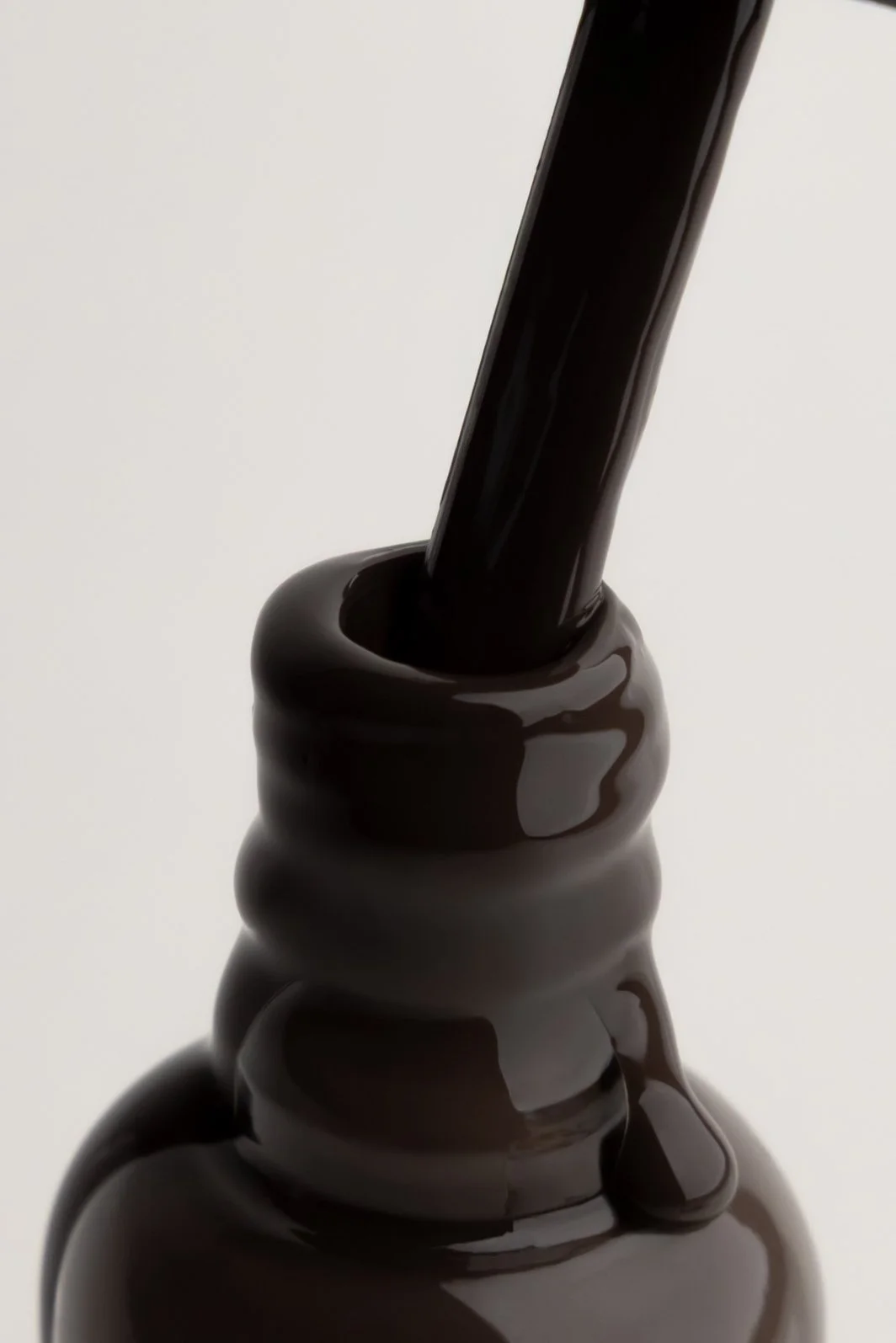 Close-up of a chocolate lava cake being poured with melted chocolate.