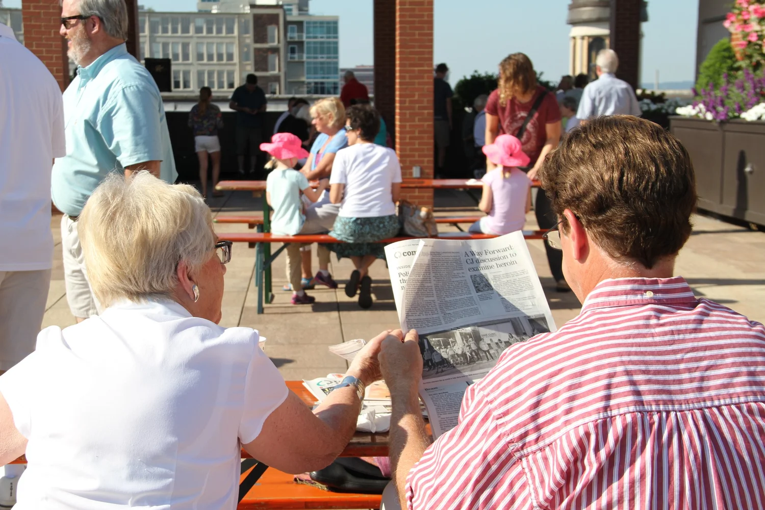 A visitor reading in the rooftop garden