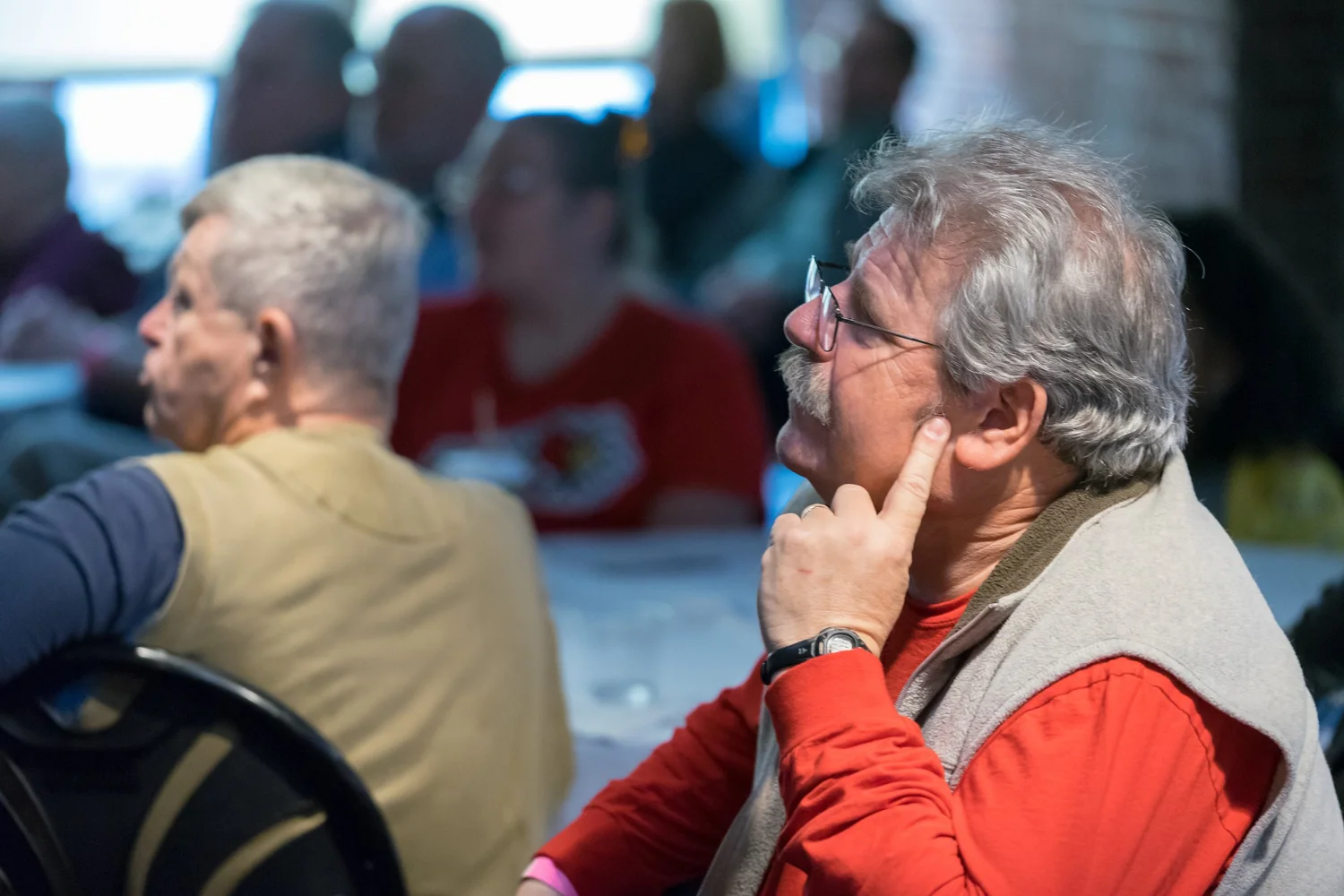 A visitor reflecting on an exhibit