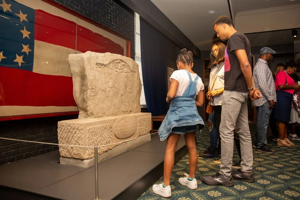 A family viewing the Bloedner Monument