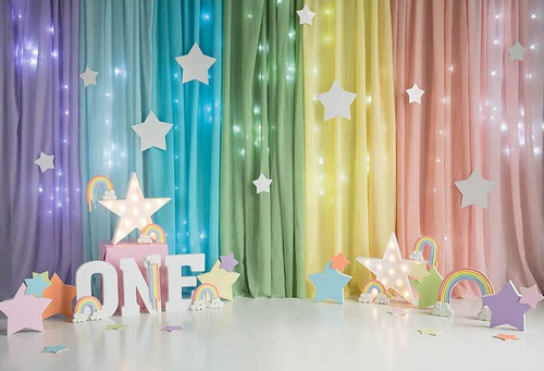 Colourful rainbow Cake Smash theme for a first birthday photoshoot
