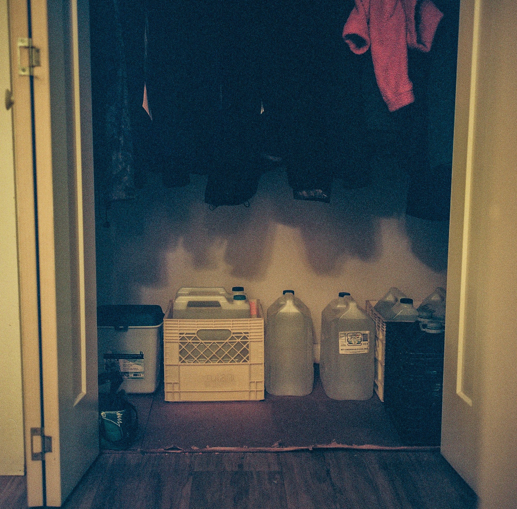 A closet full of bottled water in the home of elder Ronnie Moonias