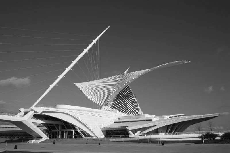 Black and white photo of the futuristic Museum of Arts and Sciences in Valencia, Spain, featuring a distinctive sail-like structure.