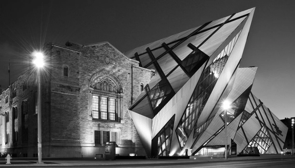 Black and white image of a contemporary addition to a museum in Canada