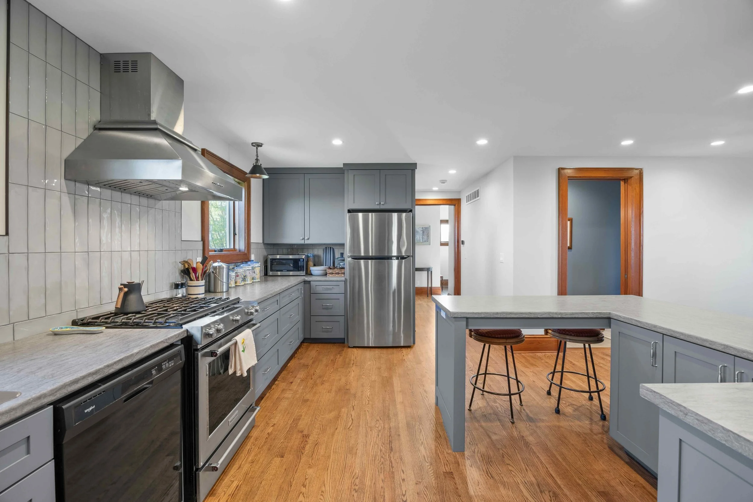 l-shaped kitchen in a fully remodeled home; space planning performed by Form Function Studio