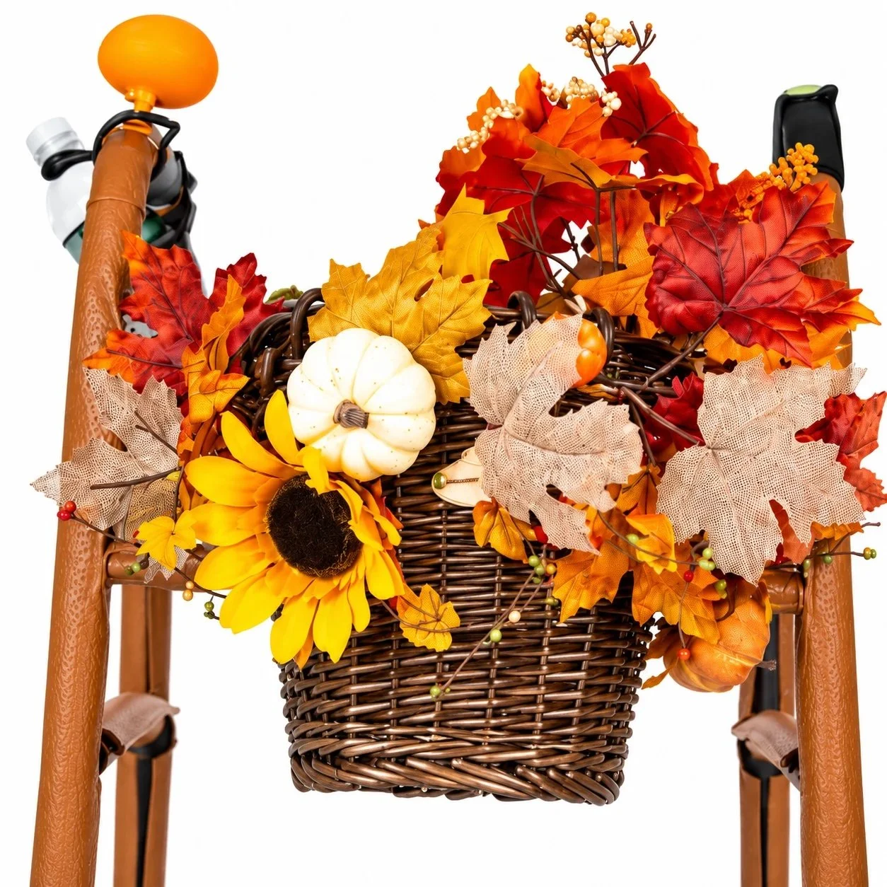 Close-up of Autumn Leaves wicker basket, sunflower, pumpkin, and fall foliage