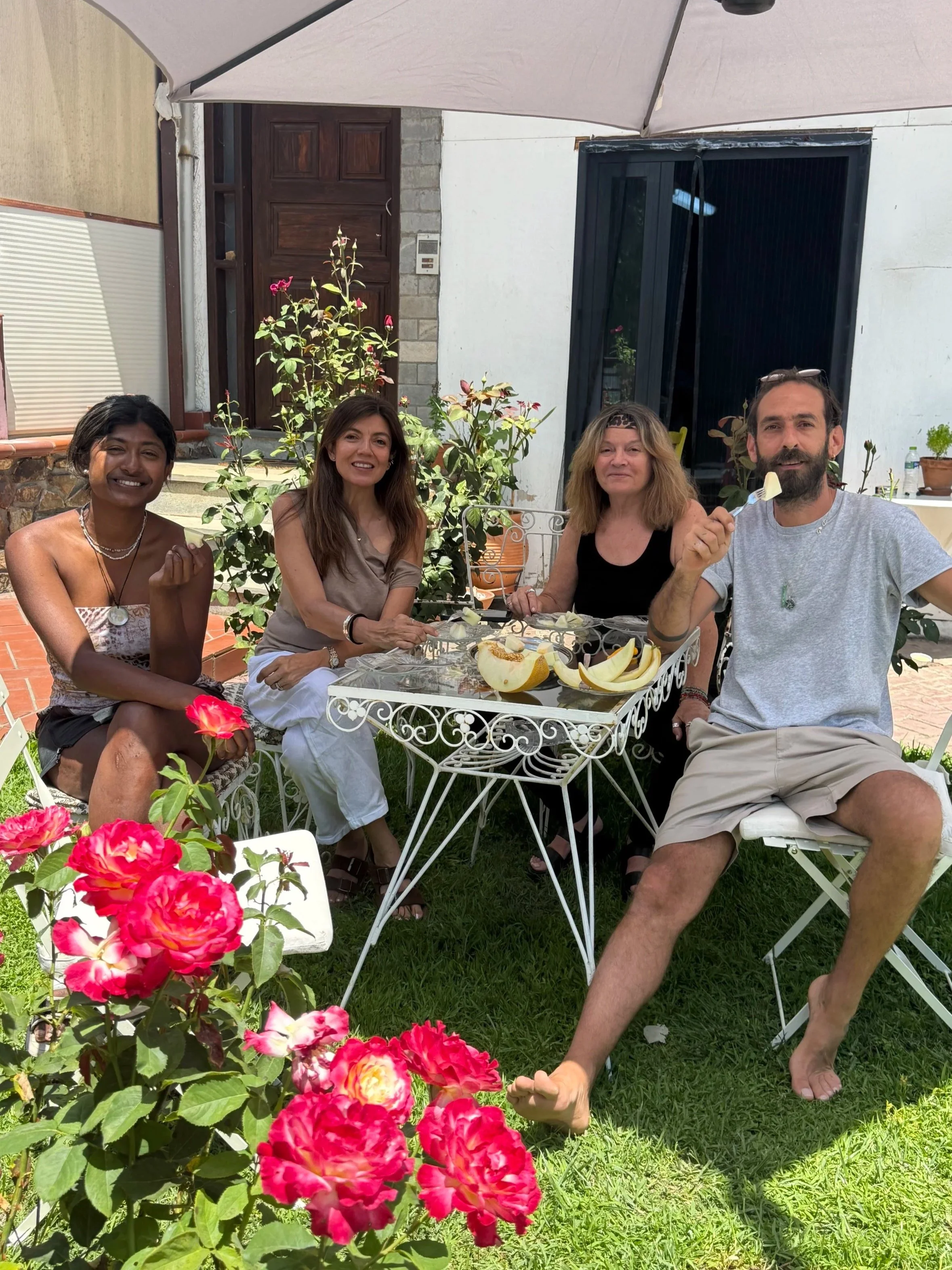 Students taking a fruit break in the garden between jewellery training sessions