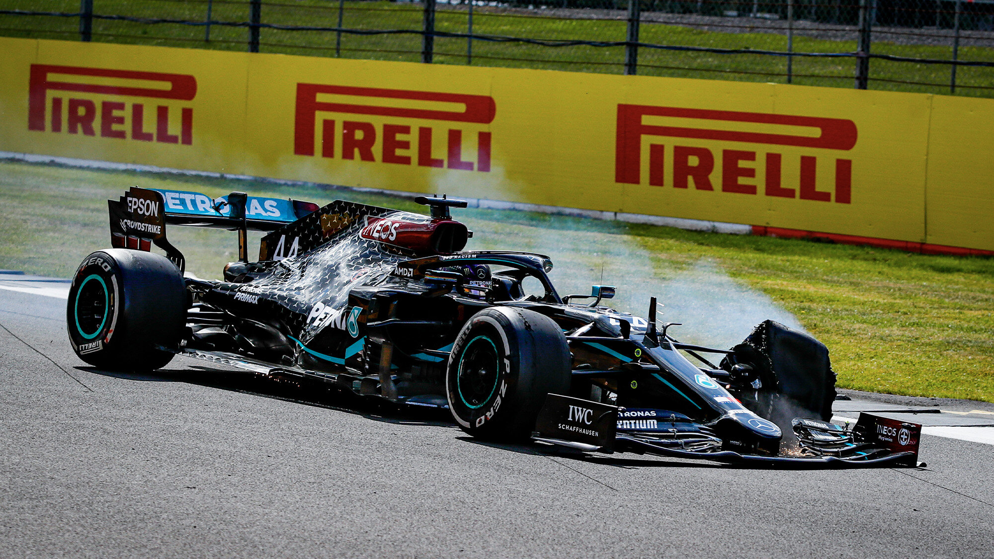 Lewis-Hamiltons-punctured-tyre-smoiking-on-the-final-lap-of-the-2020-F1-British-Grand-Prix.jpg
