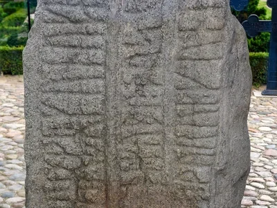King-Thyre-writing-Gorm-the-Old-memorial-Jelling-Stone-Denmark.webp
