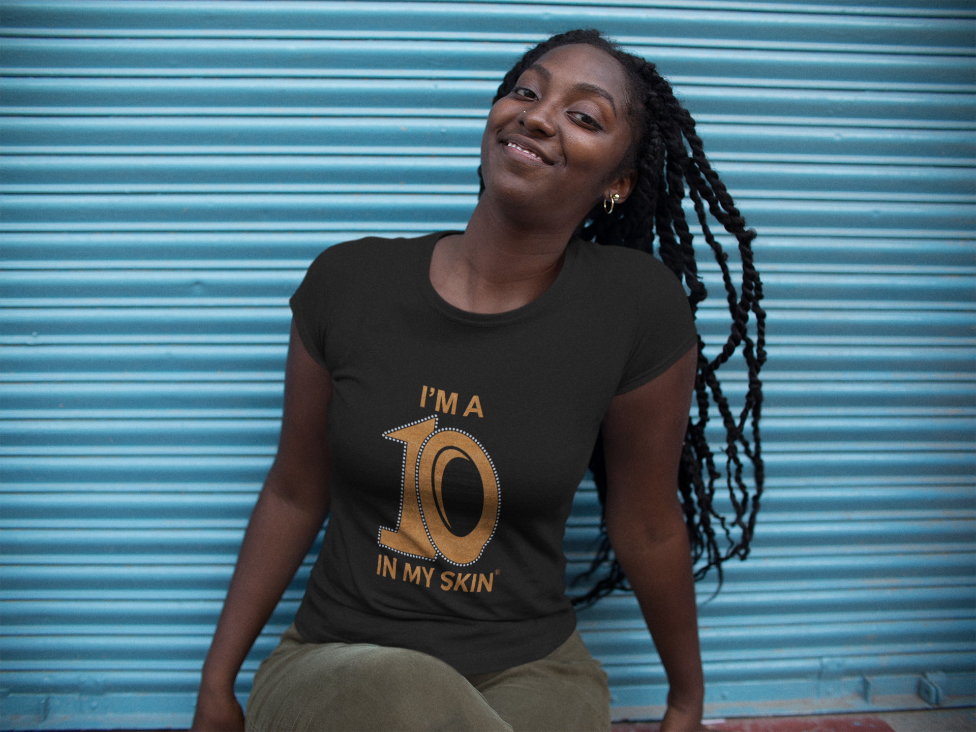 mockup-of-a-woman-wearing-a-round-neck-t-shirt-while-sitting-down-15543.png