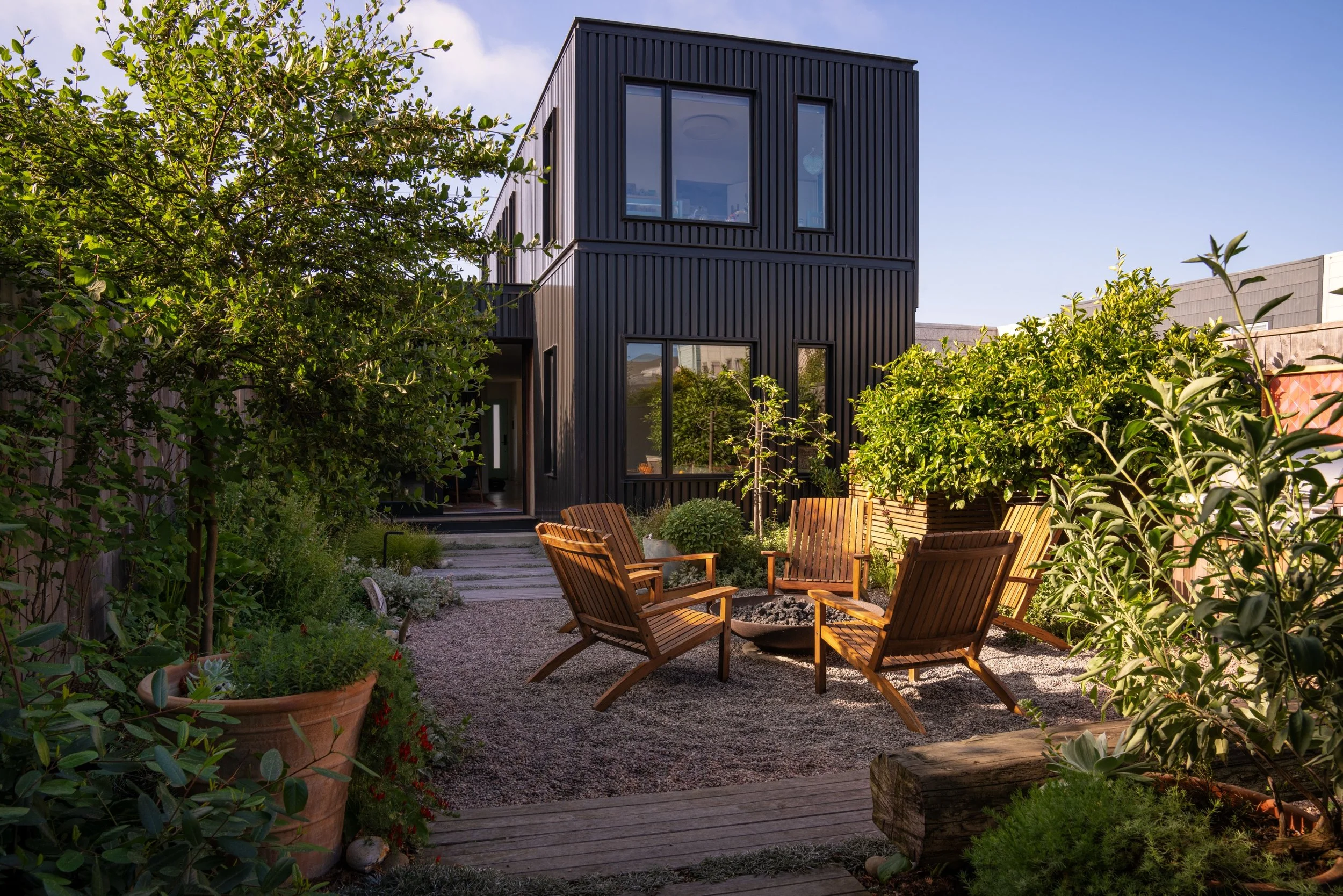 Seating around a firepit in a native garden in San Francisco