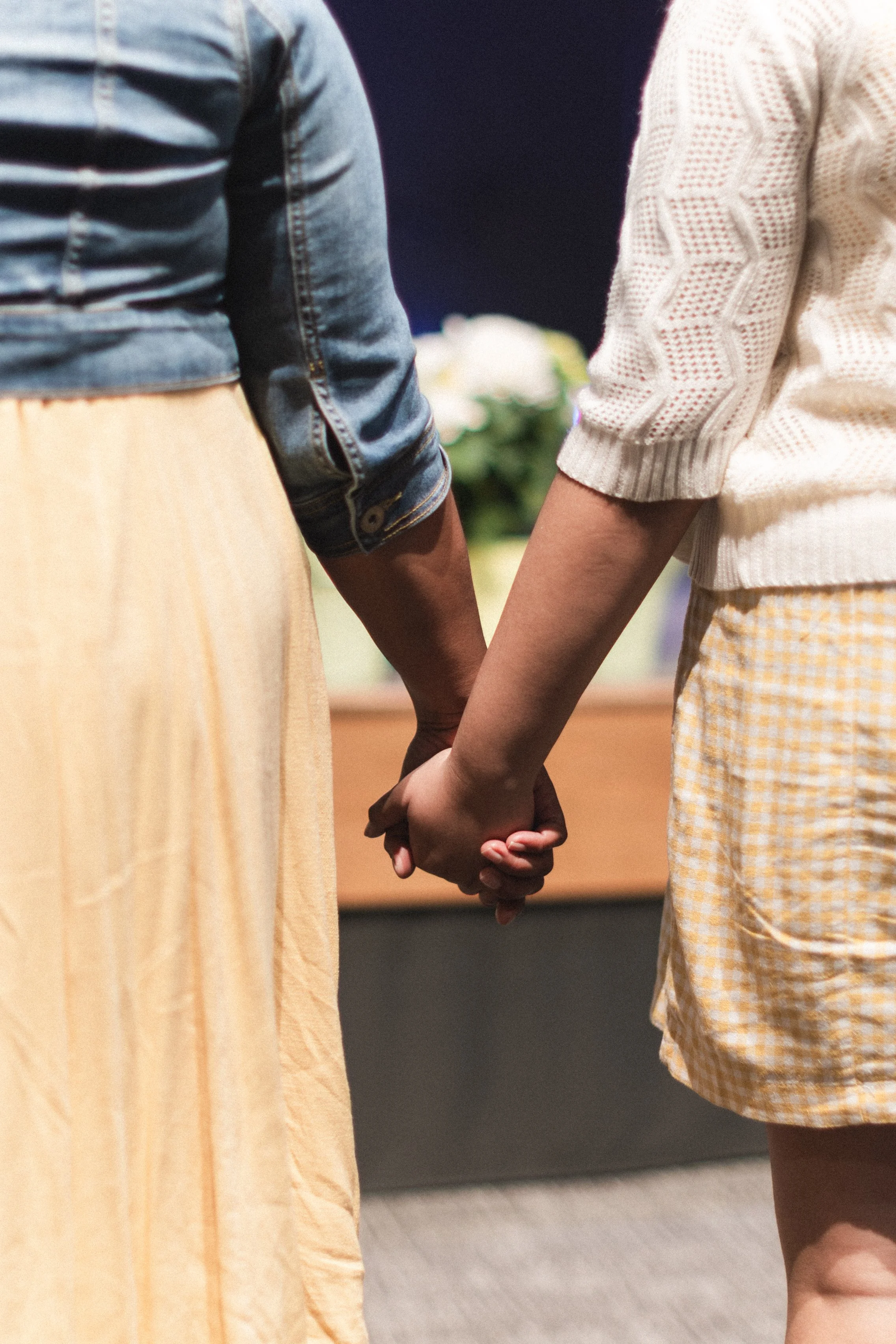 Hands in prayer at Bethel Assembly Church in Elmhurst, IL during a worship service.