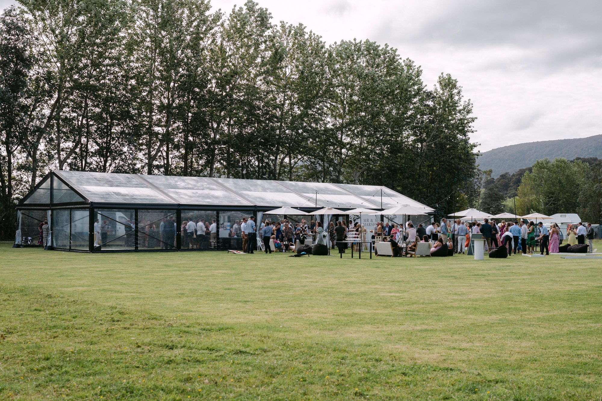 Premium Clear Marquee and hanging festoon lights set up at Jacks Point in Queenstown for a wedding | You Gather Events located in Canterbury & Central Otago.