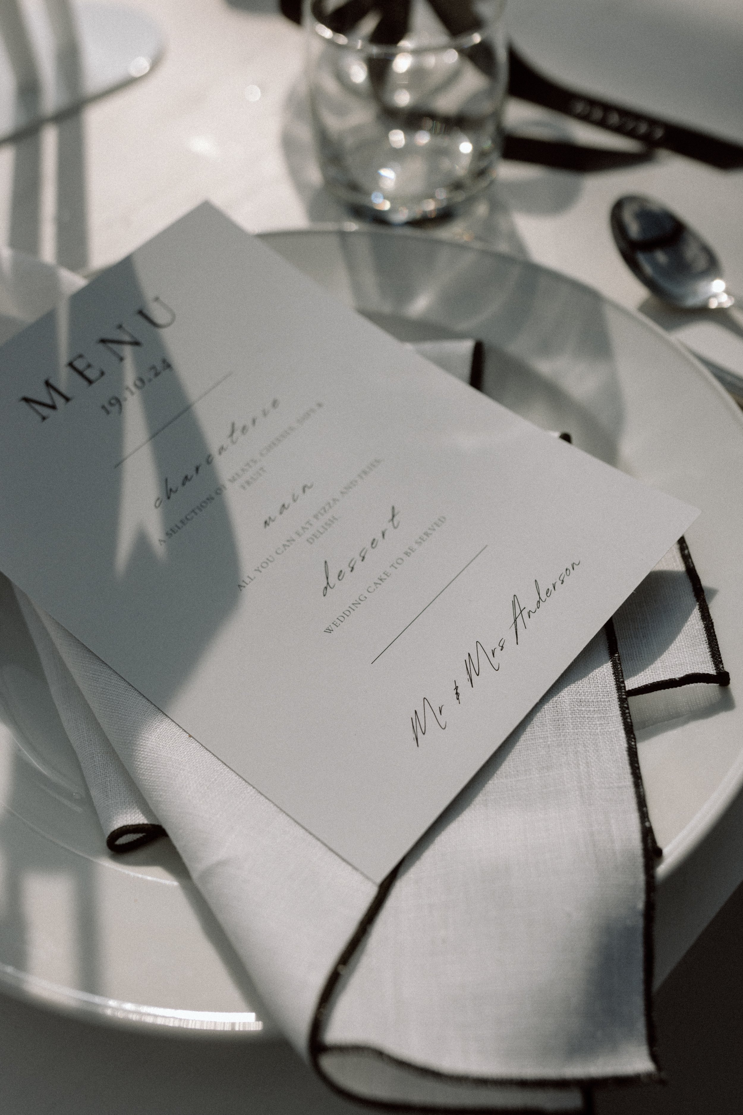 Black and white linen napkins styled on a wedding table for a wedding by You Gather Events