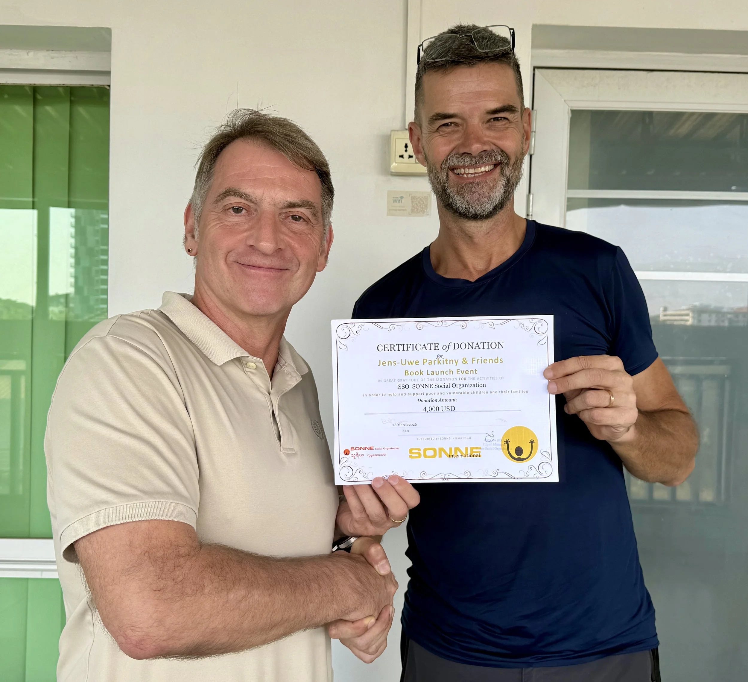 Jens Uwe Parkitny raised USD 4,000 through books sales of "The Last Face-Tattooed Chin Women of Myanmar" and a charity auction . The funds were donated to Sonne Social Organization (SSO) in Myanmar, represented by Jochen Meisser.