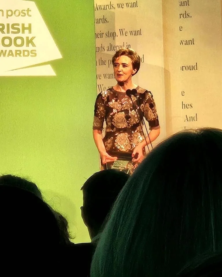 Liz seen through the crowd