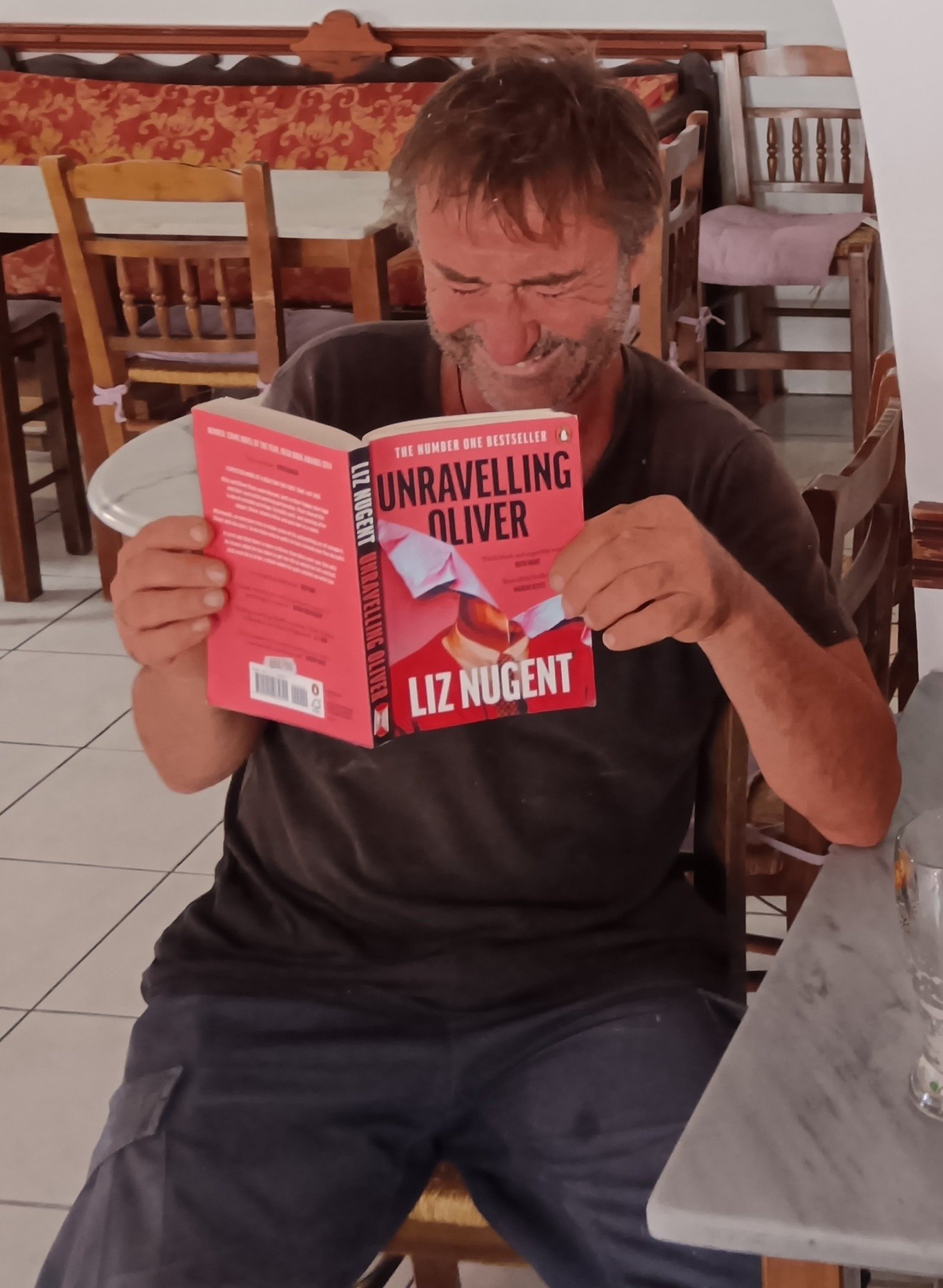 Maura got this guy to pose with Liz's book