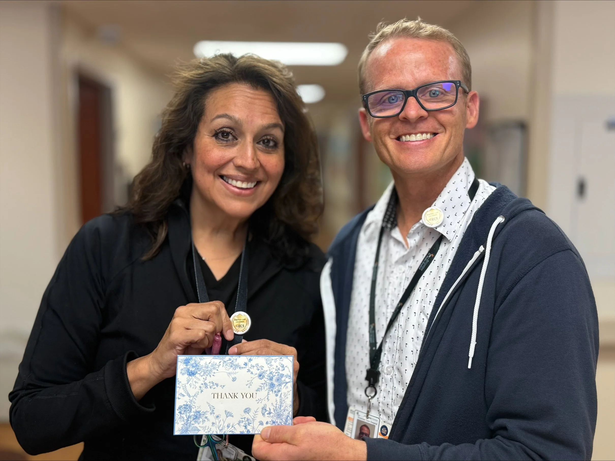 Chaplain Robert Magarrell celebrates Mountainview Hospital RN Maggie Smith