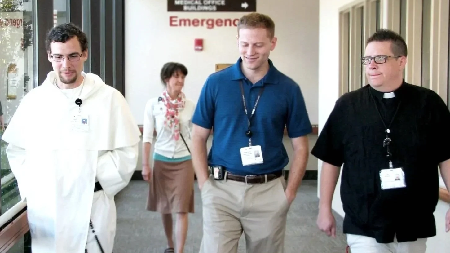 Image of chaplains walking the halls of the hospital.