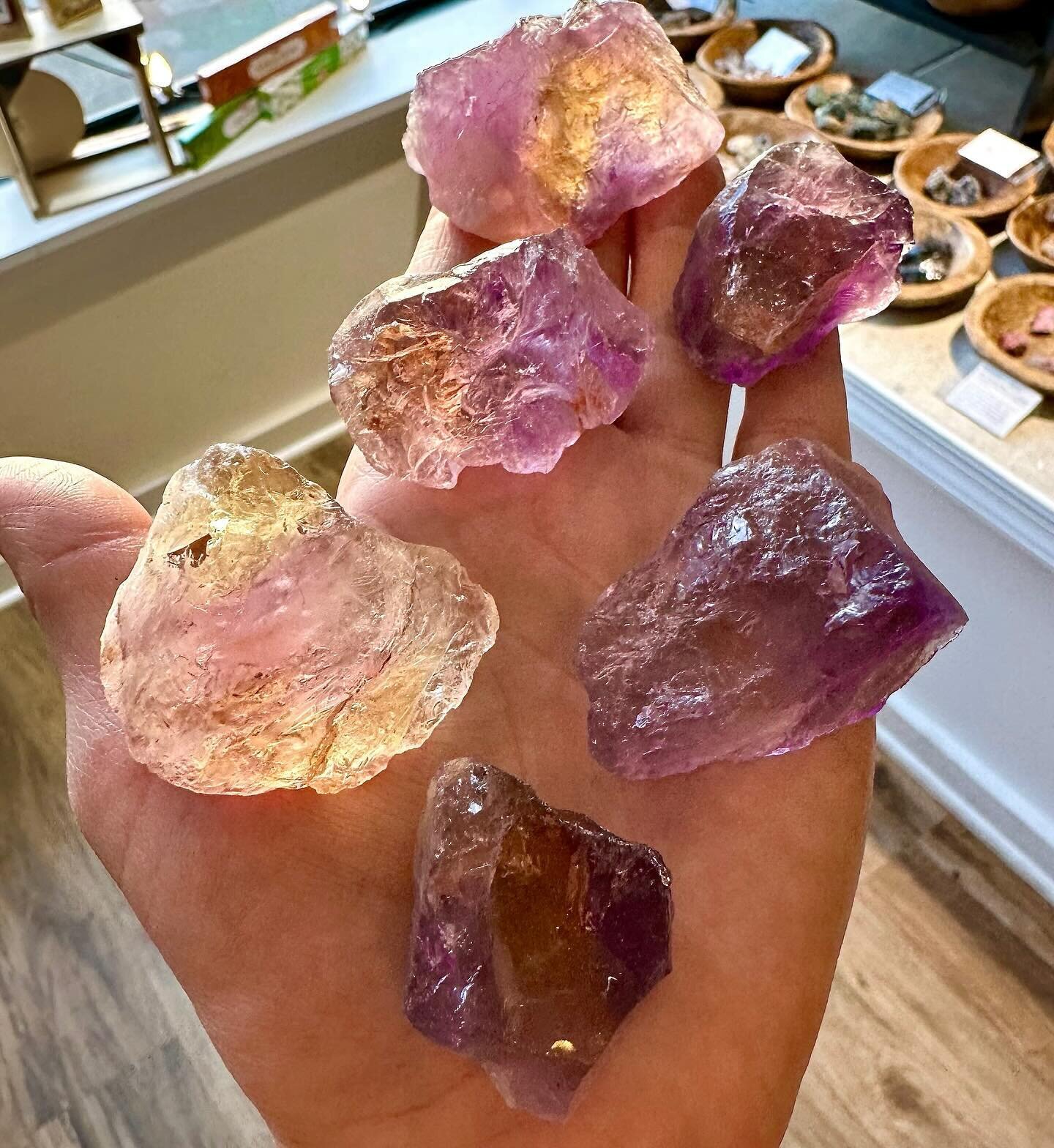 Ametrine is a bicolor quartz that has zones of amethyst (purple) and citrine (yellow) within the same crystal. It forms when quartz crystals grow together with different iron impurities and oxidation states as well specific temperature variations and
