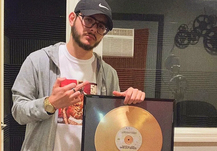 John Anthony receives gold “Words Are Weapons” plaque.