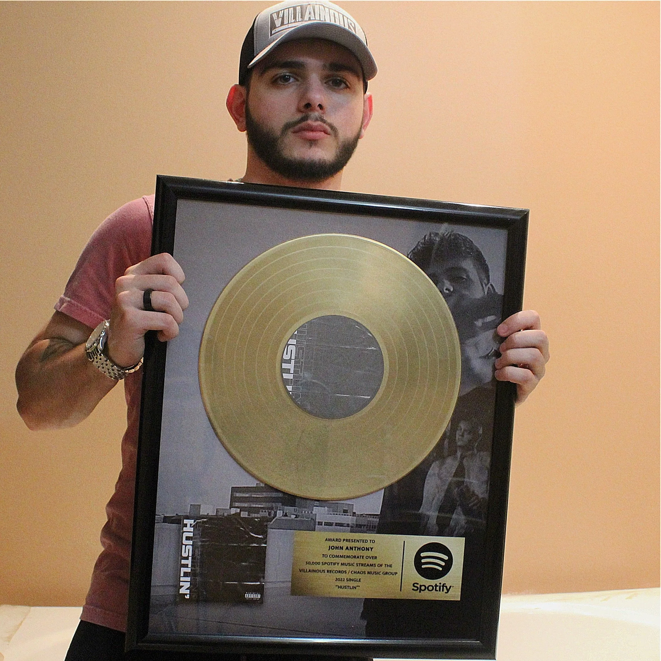 John Anthony Receives Gold Record for “Hustlin’”.